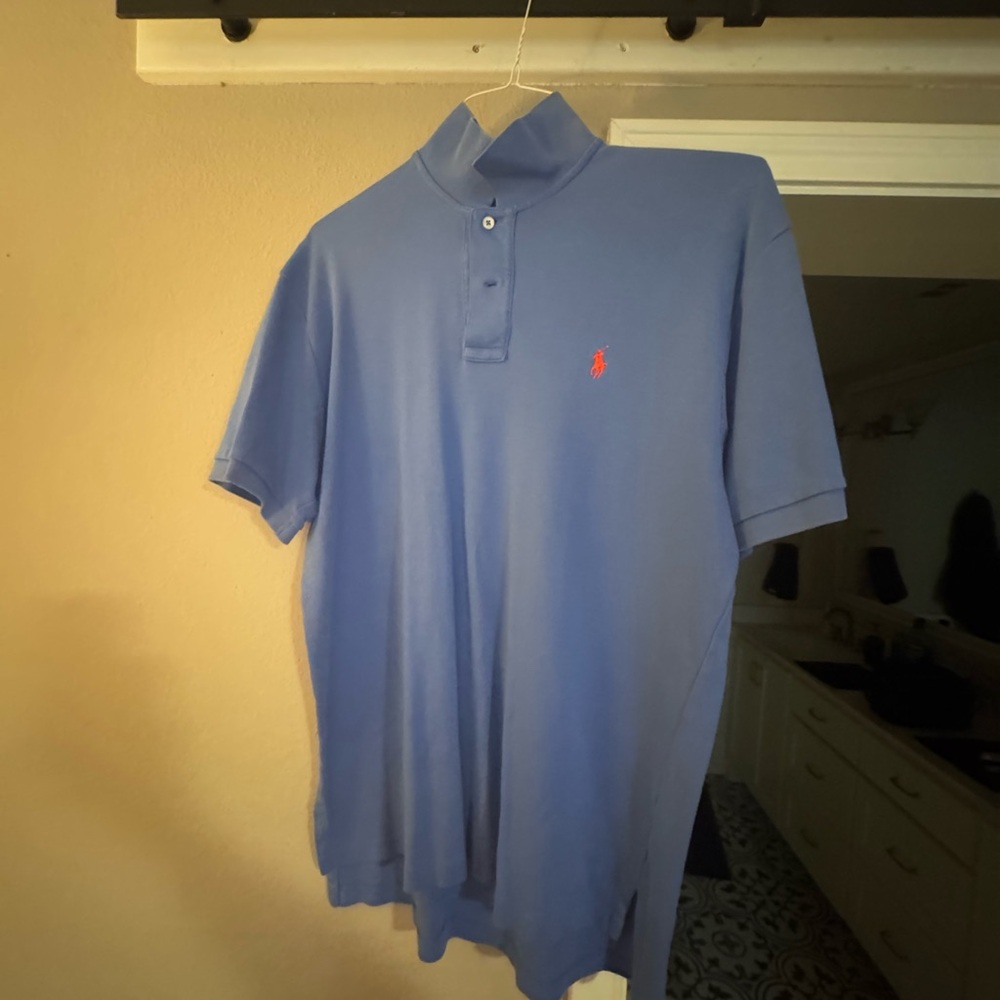 Medium size polo. Blue color. Great condition